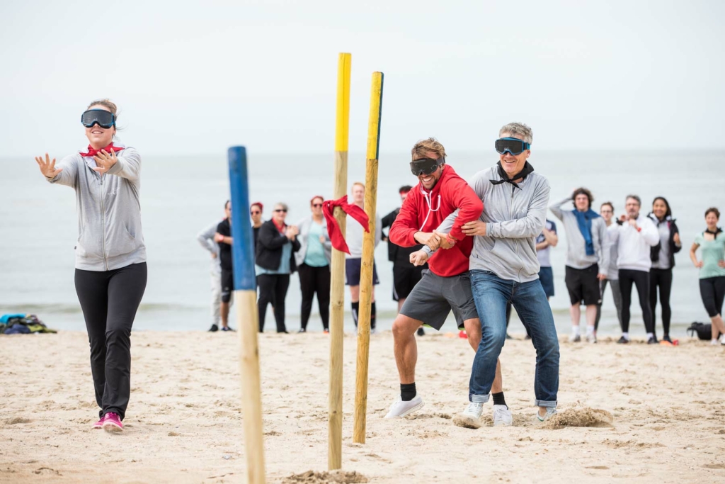 participants from different teams competing in a Robinson's Quest challenge