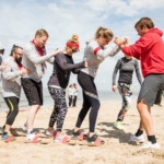 team participating in the beach ski during the Robinson's Quest