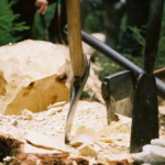 axes planted in a tree trunk for the Forest Games