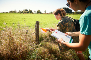 participants finding a Pathfinder tag with the help of a map