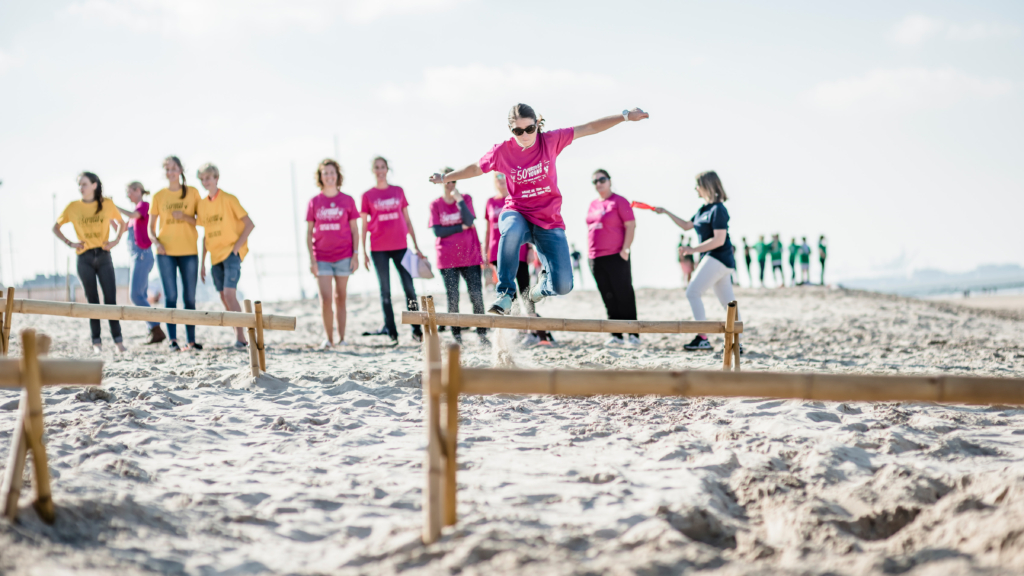 participants hurdling on the beach for Robinson's Quest