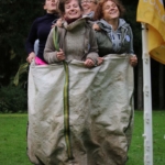 team doing a bag race during teambooster