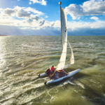 participant doing catamaran during the Beach & Water Olympics