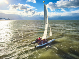 participant doing catamaran during the Beach & Water Olympics