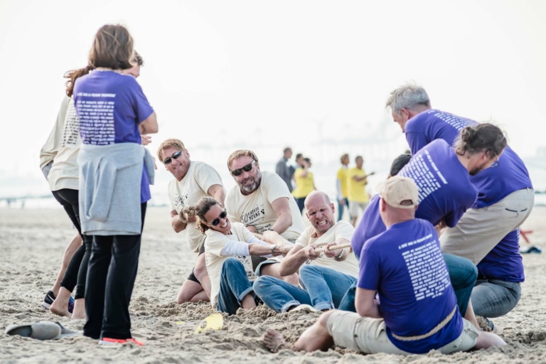 participants in the Beach & Water Olympics tug-of-war event