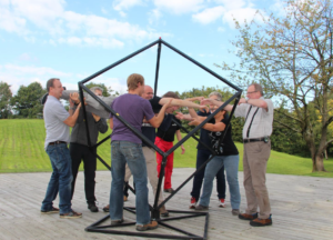 team making a participant travel through a spacio-cube of the Jengame