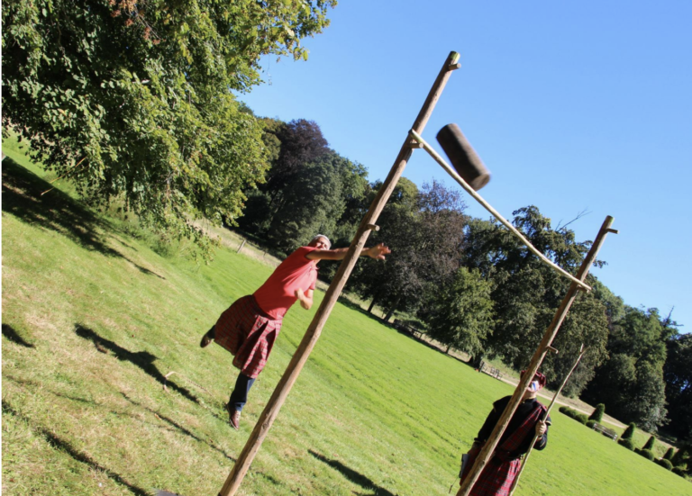 participant doing the weight throw at the Highland Games