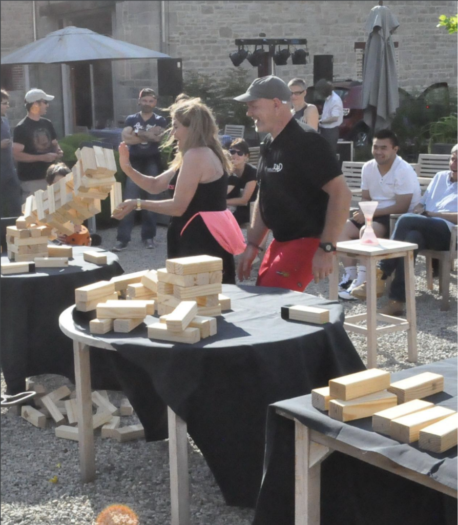 participant playing Jenga during the final of the Jengame