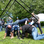 team making a participant travel through a spacio-cube of the Jengame