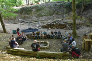 participants debriefing sitting at the camp