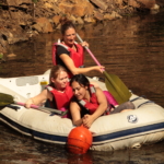 participants in an inflatable boat on the water during the Lost