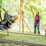 participant on a zip line during the Lost