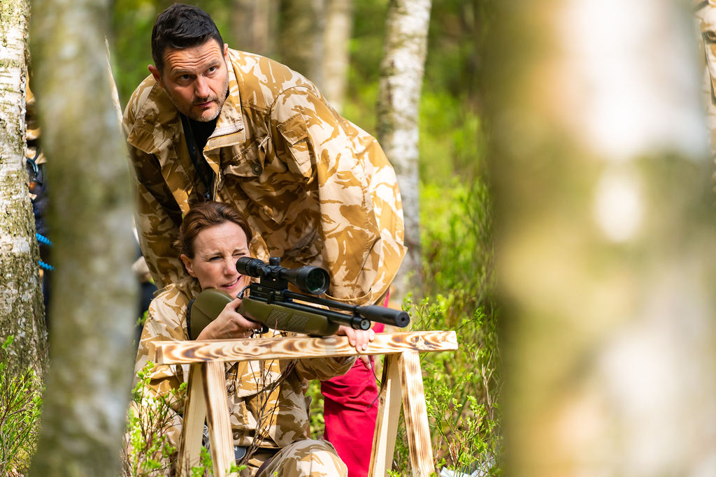 participant shooting a rifle during the Step out of your comfort zone