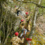 participants climbing along the rope course during the Step out of your comfort zone