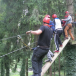 team climbing in the trees during a boar game